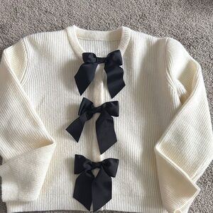 Cream Sweater with Black Bows
